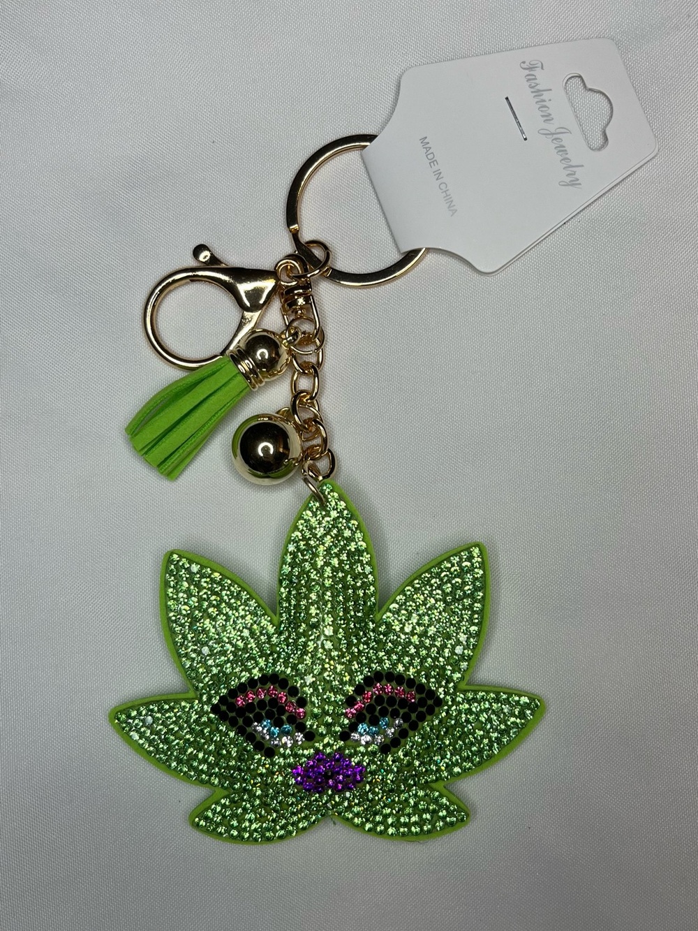 Fashion Jewelry Green Sparkle Leaf Face Keychain Bag Charm with Gold Hardware
